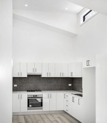 Granny-flat-sydney-living-room-open-kitchen-high-ceilings-skylights-stainless-steel-appliances