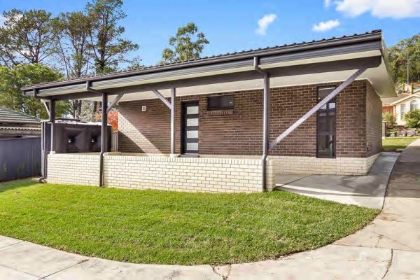granny-Flat-sydney-car-port-at-rear-black-white-bricks-monument-roof-garage