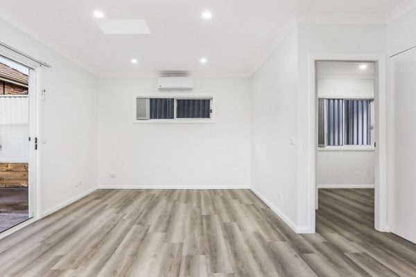 granny-flat-blue-gum-construction-corner-block-patio-living-timber-laminate-floor-2-bedrooms