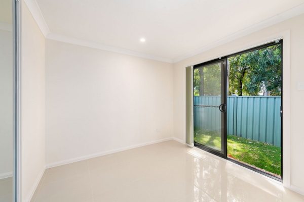 granny-flat-brick-veneer-pgh-boral-bedroom-sliding-door-back-to-garden-grass