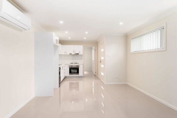 granny-flat-design-gloss-tiles-white-kitchen-hume-doors-design