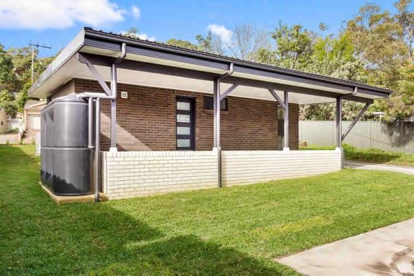 granny-flat-sydney-design-white-bricks-black-monument-watertank-back-door-rear-access