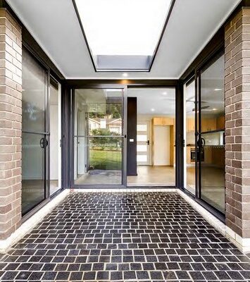 granny-flat-sydney-front-entry-black-white-bricks-pavers-three-sliding-doors-60m2-design-recess-entry